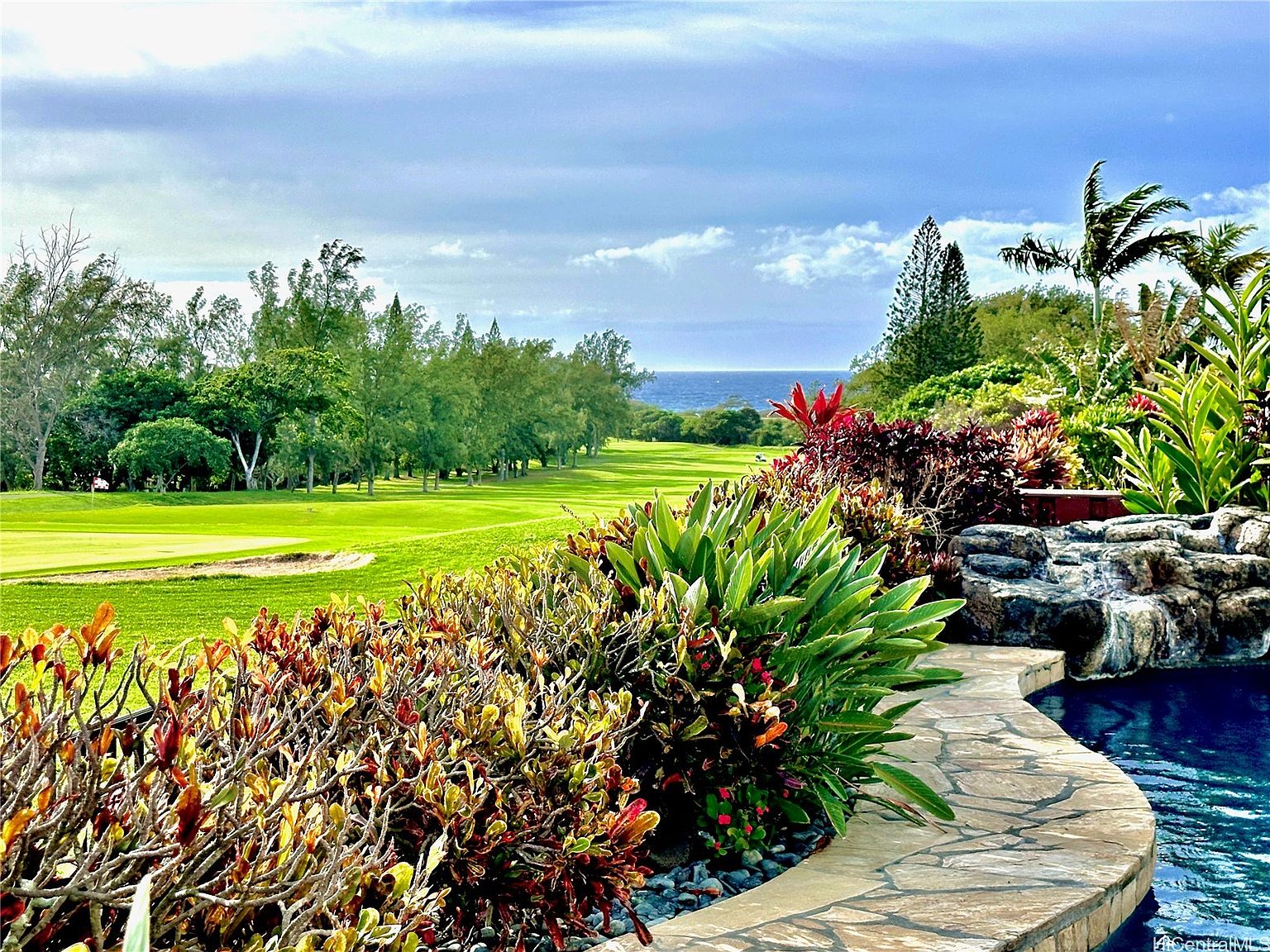Pool deck of 1047 Koko Kai Place looking across the 15th green of Hawaii Kai Golf Course to the Pacific Ocean